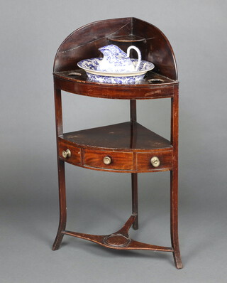 A 19th Century mahogany corner wash stand with recess, fitted a drawer and together with an associated blue and white jug and bowl 104cm h x 40cm w x 40cm d 