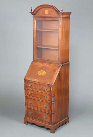A Georgian style inlaid mahogany bureau bookcase the upper section with arch shaped top, fitted shelves enclosed by glazed panelled door, the base fitted a fall front above 3 long graduated drawers with columns to the sides, raised on bracket feet 184cm h x 55cm w x 43cm d  