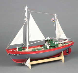 A wooden model of a fishing boat 53cm h x 69cm w x 19cm d  