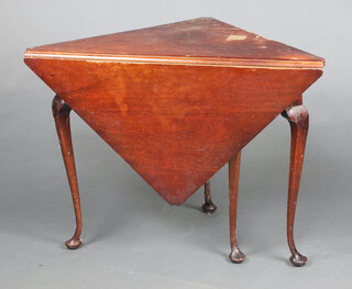 A 1920's Georgian style mahogany drop flap corner table raised on club supports 72cm h (contact marks in places) 