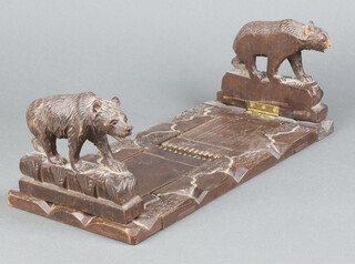 Two Swiss Black Forrest expanding carved book slides  decorated bears 11cm x 35cm x 15cm (severe damage to snout of 1 bear) 