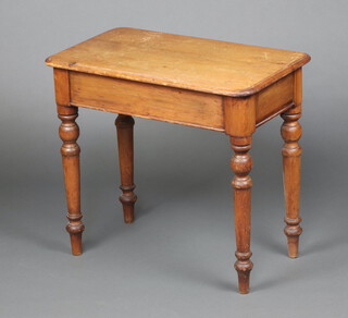 A Victorian rectangular pine table raised on turned supports 61cm h x 68cm w x 40cm d (ring and contact marks in places)
