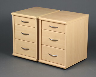 A pair of woodgrain laminate bedside chests with 3 drawers 51cm h x 34cm w x 43cm d 