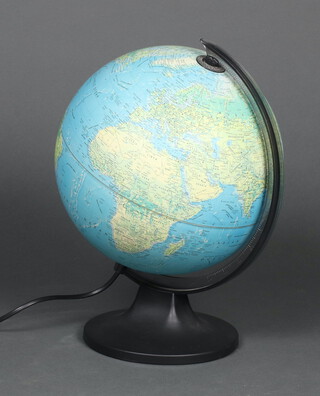 A terrestrial globe table lamp on a circular base 37cm x 20cm 