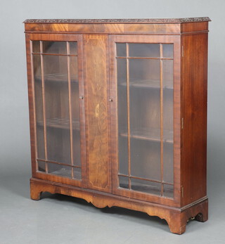 A Georgian style mahogany book/display cabinet with crossbanded top, enclosed by panelled doors, raised on bracket feet 106cm h x 106cm w x 29cm d 