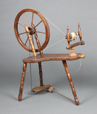 A mahogany framed spinning wheel 93cm h x 72cm w x 28cm d 
