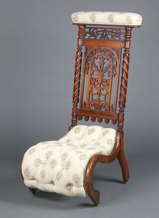 A Victorian carved and pierced walnut show frame prie dieu chair, the seat and back upholstered in tapestry material 99cm h x 52cm w x 41cm d (seat 30cm x 23cm) 