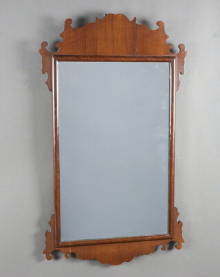 A 1930's Chippendale style rectangular plate wall mirror contained in a mahogany frame 78cm x 46cm 
