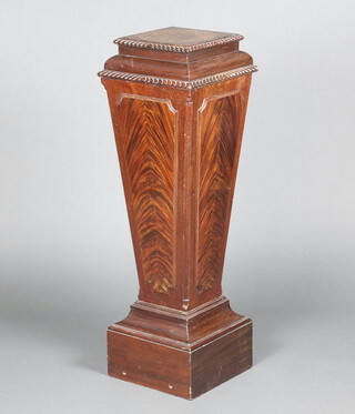 An Edwardian Empire style waisted mahogany pedestal raised on square base 108cm h x 28cm w x 27cm d 
