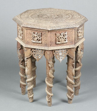 An octagonal carved Indian sewing table with hinged lid, raised on 8 turned supports 69cm h x 58cm w x 58cm d 