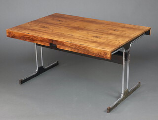 A 1970's Pieff style rosewood extending dining table, raised on figured chrome supports with wooden stretcher 71cm h x 91cm w x 137cm l when closed x 198cm l when extended, supplied with a Cites Article 10 certificate, reference No. 24GBA10WV4NT5 