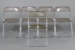 Giancarlo Piretti for Anonima Castelli,  a set of 5 Italian Plia chrome and perspex folding chairs, the seats and backs formed of recessed smoky perspex, 74cm x 47cm x 39cm