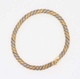 A yellow and white metal 750 mesh bracelet 17.4 grams, 18cm 