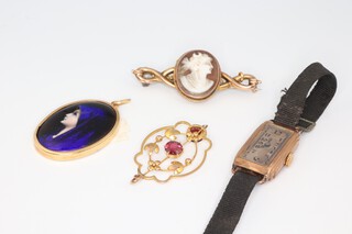 A yellow metal enamelled pendant, a gem set ditto, wristwatch and brooch 
