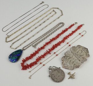 A natural coral necklace 40cm, a silver belcher link chain hung a a hardstone pendant, a 925 pendant in the form of an aeroplane and other minor jewellery 