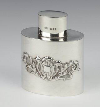 A Victorian oval repousse silver tea caddy with scroll decoration London 1895, 8cm, 75 grams 