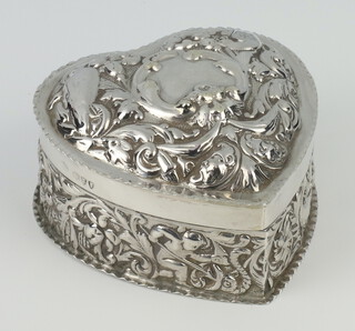A Victorian repousse silver heart shaped trinket box decorated with masks and scrolls London 1894, 104 grams, 9cm 