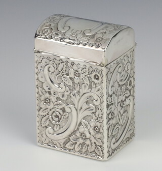 A Victorian repousse silver dome topped card case decorated with scrolls and flowers and vacant cartouche, Chester 1899, 8.5cm 