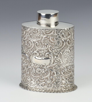 A Victorian oval repousse silver tea caddy decorated with scrolls and flowers and vacant cartouche, Chester 1899, 11cm, 123 grams 