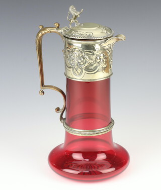 A Victorian ruby glass ewer with repousse silver plated mounts decorated with masks, 29cm