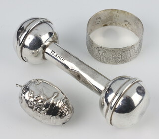 A Victorian style silver babies rattle Birmingham 1998, a napkin ring and an egg shaped rattle, 59 grams