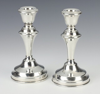 A pair of Georgian style silver dwarf waisted candlesticks London 1860, 13cm 