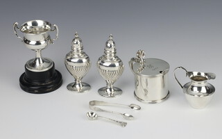 A Georgian style silver mustard pot Sheffield 1923, a trophy cup, 2 condiments, jug, sugar nips and spoon, 237 grams  