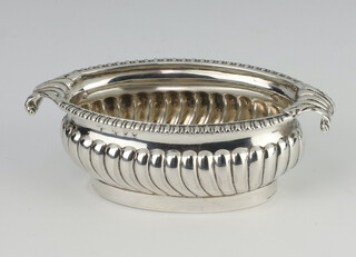 A Victorian demi fluted oval silver mustard with scroll handles, London 1891, 66 grams, 9cm