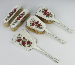 A 5 piece silver and guilloche enamel dressing table set Birmingham 1979 comprising 2 hair brushes, 2 clothes brushes and a hand mirror, decorated with roses 