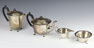 A 4 piece silver tea and coffee set Sheffield 1936 with ebony mounts, gross weight 1249 grams 