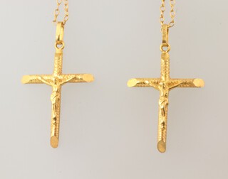 A yellow metal 18k cross pendant and chain and a ditto, both 38cm, 5.1 grams 