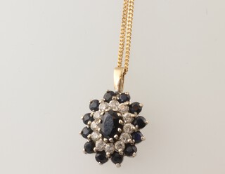 A yellow metal 18k necklace 40cm and a sapphire pendant, 2 grams 