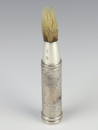 A Victorian silver travelling shaving brush with engraved scroll decoration and vacant cartouche, London 1885