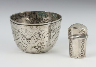 A circular Continental silver cup with repousse decoration 6cm and a Georgian silver scent bottle case 4cm 