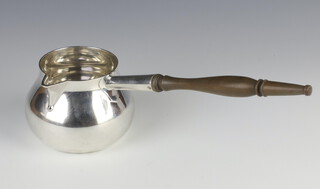 A Georgian style silver plated brandy warmer with turned wood handle 