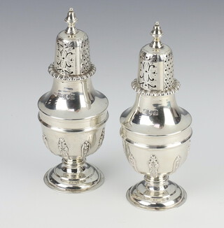A pair of Edwardian silver baluster peppers London 1899, 164 grams, 12cm 