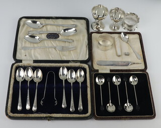 A cased set of 6 silver teaspoons and sugar nips, Sheffield 1920, together with 5 bean end spoons, 4 other spoons, 1 fork, 2 napkin rings, 2 egg cups and a silver blade, gross weight 313 grams 
