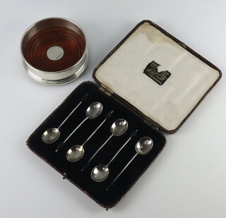 A Georgian style silver bottle coaster Birmingham 2001, 9cm and 6 silver bean end coffee spoons Sheffield 1925 