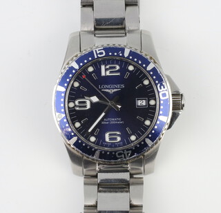 A gentleman's steel cased Longines blue dial calendar wristwatch  with blue bezel on a steel bracelet the movement L619.2 the case 49598109 Hydro Conquest L3.742.4 with original box and papers, contained in a 40mm case