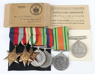 A World War II medal group comprising 1939-45 Africa and Italy Stars, Defence and War medal, complete with posting box to A E Gregory, together with 2 Defence medals 