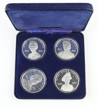Four silver commemorative medallions 1977, each approximately 27 grams 
