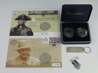 A 925 standard USB stick, 4 commemorative crowns and a pendant