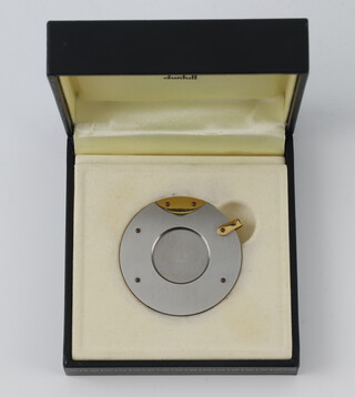 A Dunhill circular steel cigar cutter cased