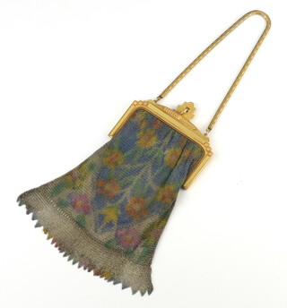 A vintage Whiting and Davis Company mesh bag with gilt metal clasp and mirror 