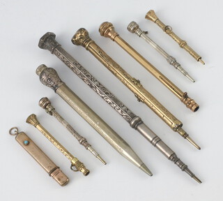 An Edwardian gilt propelling pencil, 3 others, a pencil and 2 white metal propelling pencils 