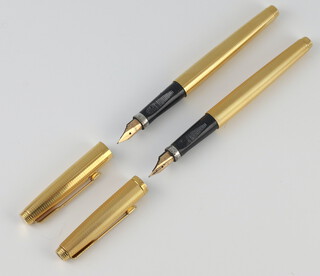 A gentleman's gilt Parker fountain pen with 14k mount, and one other similar Parker fountain pen 
