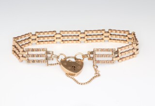 A 9ct yellow gold gate bracelet with heart padlock 11.7 grams, 18cm 
