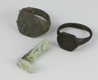 A Roman bronze ring with geometric decoration size P 1/2, with Coincraft certificate of authenticity, a Byzantine ditto size P 1/2 and an Egyptian hardstone figure 3cm (stuck) 