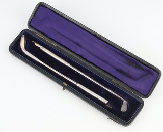A novelty white metal propelling pencil in the form of a golf wood together with a pen in the form of a golf iron marked S M & Co, in a fitted case, 17cm 