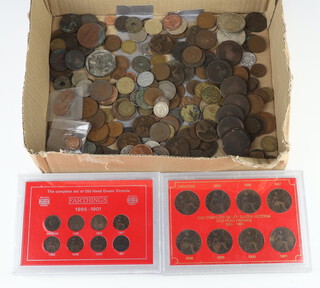 A collection of Victorian bun pennies (rubbed) and other coins 